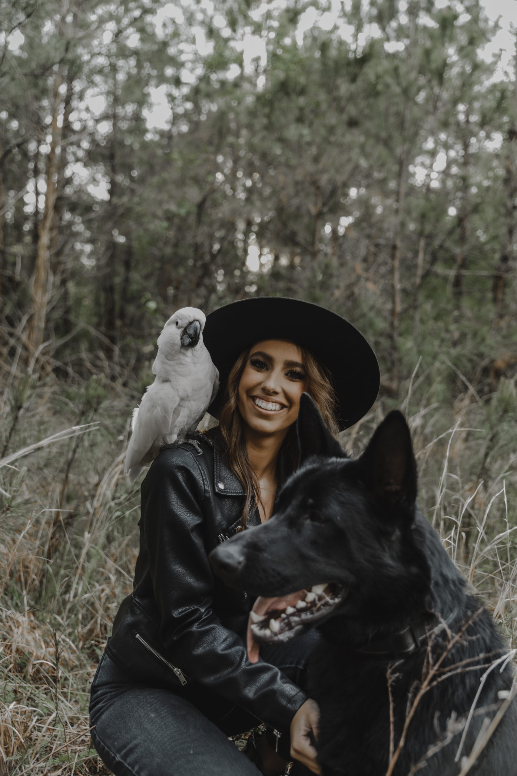 katlyn with her dog and bird, bane and besha